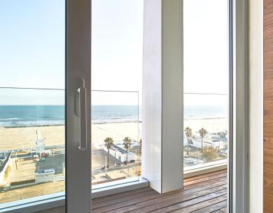 Sea view from a glass door with terrace.