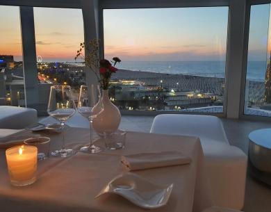 Romantic dinner with a sea view at sunset.