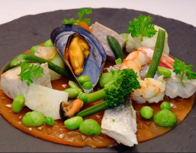 Gourmet dish with seafood and vegetables.