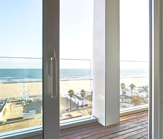 Sea view from a glass door with terrace.