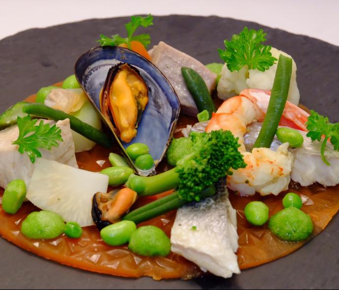 Gourmet dish with seafood and vegetables.